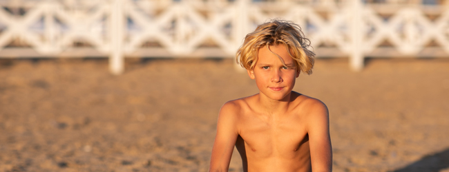 Young student on the sandy beach in Eastbourne, England, during summer camp